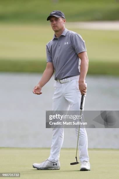 Jordan Spieth lines up a putt on the 17th hole during the first round of the Travelers Championship at TPC River Highlands on June 21, 2018 in...