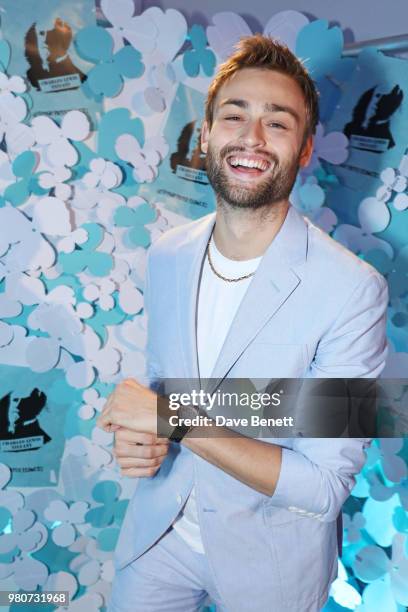 Douglas Booth attends as Tiffany & Co. Celebrates the launch of the Tiffany Paper Flower collection at The Lindley Hall on June 21, 2018 in London,...