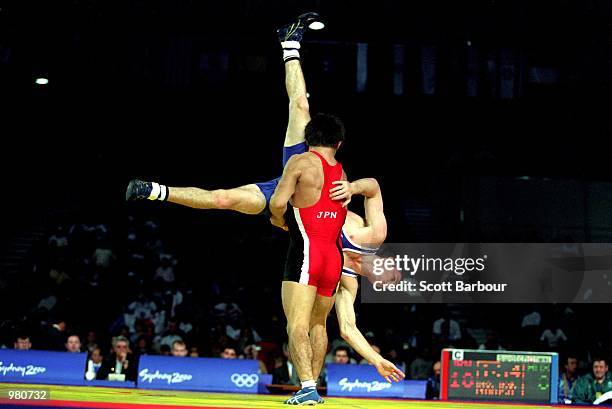 Brett Cash of Australia and Makoto Sasamoto of Japan in action during the Men's 58kg Greco Roman Wrestling held at the Sydney Convention Centre...