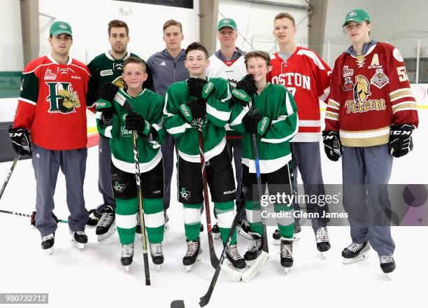 Top prosects Evan Bouchard, Rasmus Dahlin, Noah Dobson, Andrei Svechnikov, Brady Tkachuk and Filip Zadina pose with young hockey players at the Top...