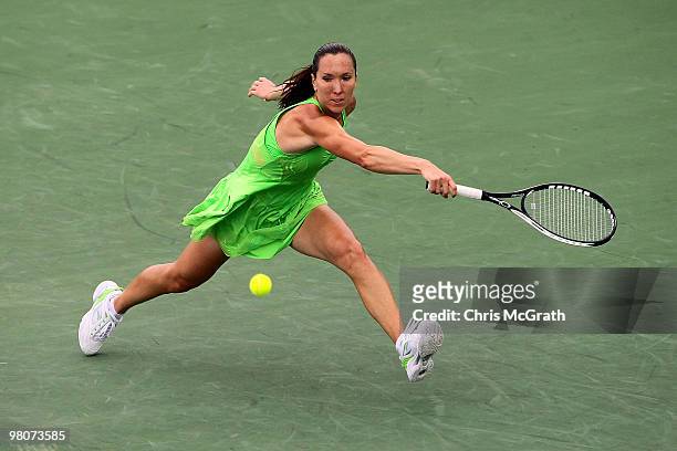 Jelena Jankovic of Serbia returns a shot against Mariya Koryttseva of Ukraine during day four of the 2010 Sony Ericsson Open at Crandon Park Tennis...