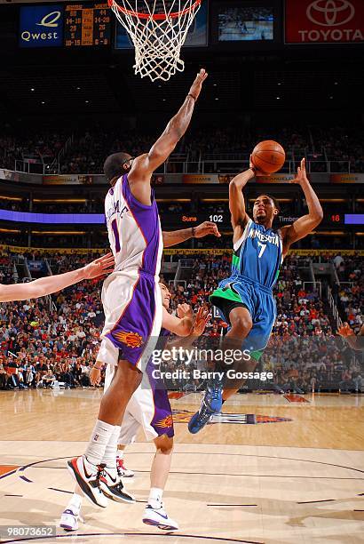 Ramon Sessions of the Minnesota Timberwolves goes up for a shot against Amar'e Stoudemire of the Phoenix Suns during the game at U.S. Airways Center...