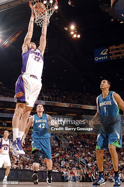 Louis Amundson of the Phoenix Suns goes to the basket against Kevin Love and Ryan Hollins of the Minnesota Timberwolves during the game at U.S....