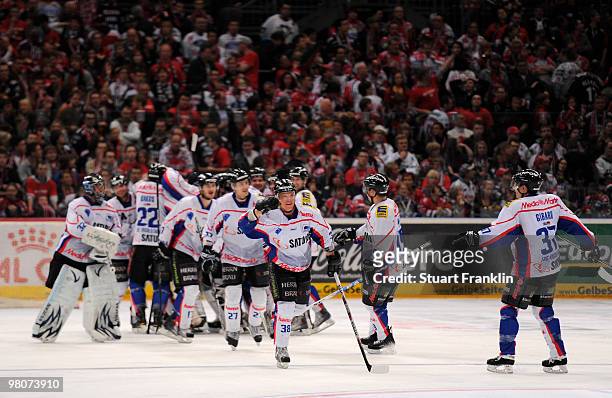 Players of Ingolstadt celebrate their teams win at the end of the DEL playoff match between Koelner Haie and ERC Ingolstadt on March 26, 2010 in...