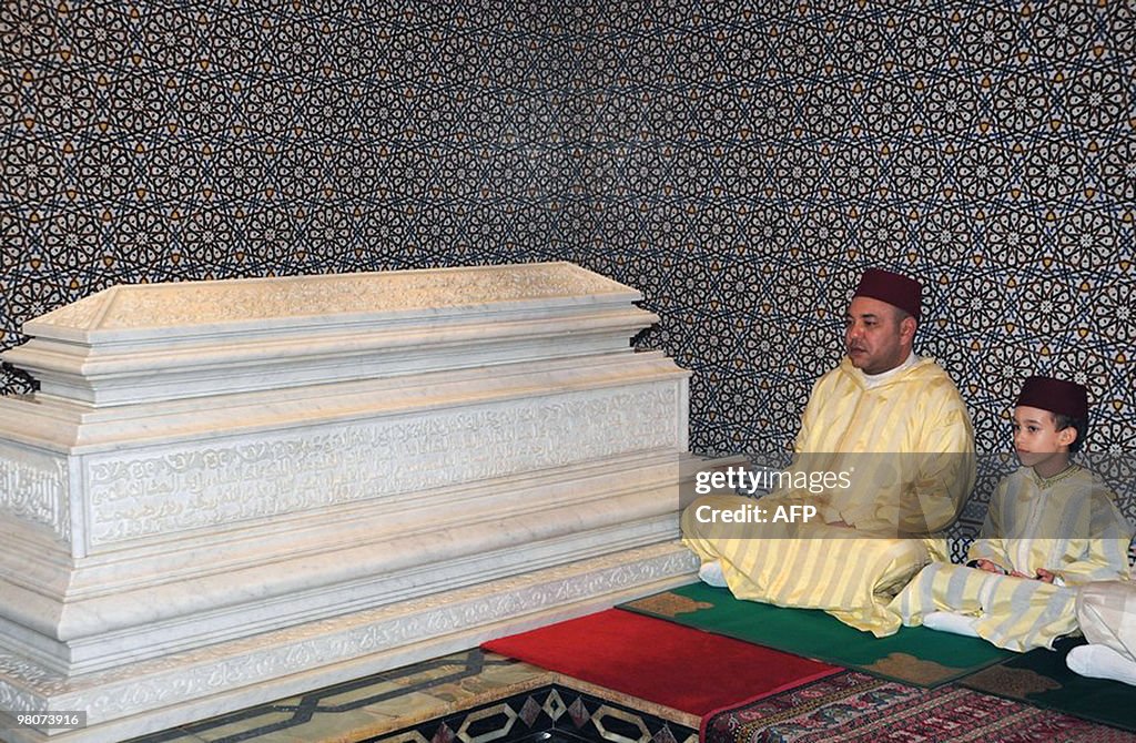 Moroccan King Mohamed VI (L) and his son