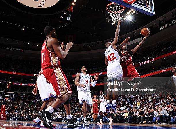 LeBron James of the Cleveland Cavaliers shoots a layup against Elton Brand of the Philadelphia 76ers during the game at Wachovia Center on March 12,...