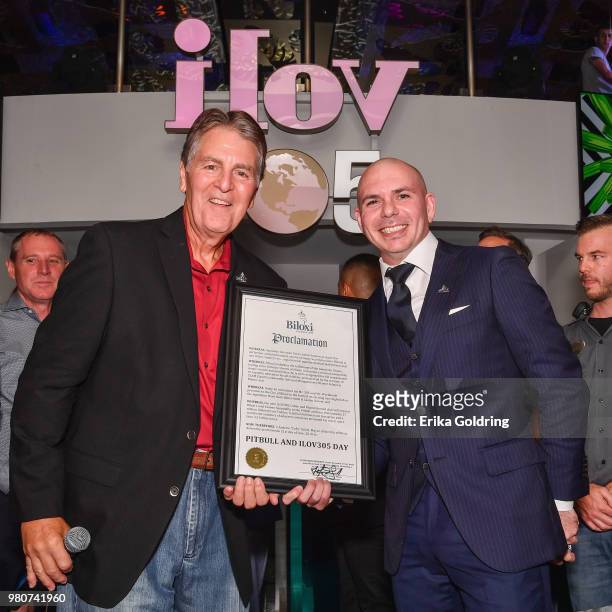 Mayor Andrew "FoFo" Gilich and Armando Christian Perez aka Pitbull attend the grand opening of iLov305 at Hard Rock Hotel and Casino Biloxi on June...