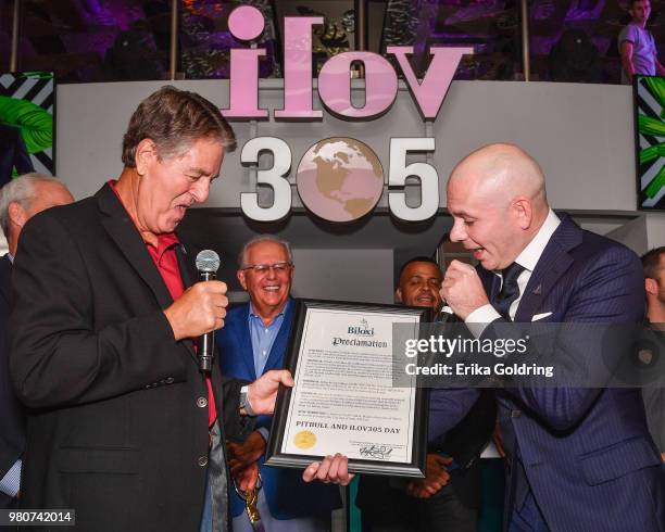 Mayor Andrew "FoFo" Gilich and Armando Christian Perez aka Pitbull attend the grand opening of iLov305 at Hard Rock Hotel and Casino Biloxi on June...