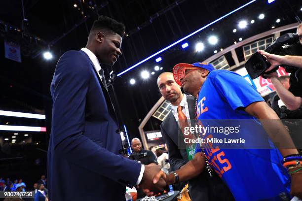 Draft Prospect Mohamed Bamba speaks to head coach Shaka Smart of the Texas Longhorns and director Spike Lee during the 2018 NBA Draft at the Barclays...