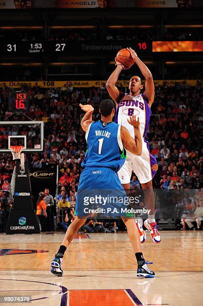 Channing Frye of the Phoenix Suns shoots a jump shot against Ryan Hollins of the Minnesota Timberwolves during the game at U.S. Airways Center on...