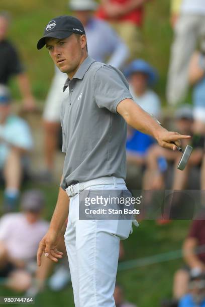 Jordan Spieth reacts to his putt on the 15th hole during the first round of the Travelers Championship at TPC River Highlands on June 21, 2018 in...