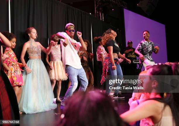 Rapper Silento and musical artist Tyeler Reign perform onstage at Jillian Estell's red carpet birthday party with a purpose benefitting The Celiac...