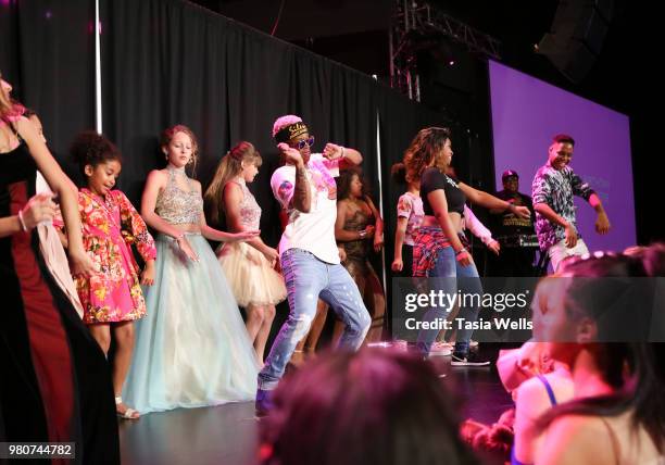 Rapper Silento and musical artist Tyeler Reign perform onstage at Jillian Estell's red carpet birthday party with a purpose benefitting The Celiac...