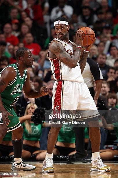 LeBron James of the Cleveland Cavaliers handles the ball against Ronald Murray of the Chicago Bulls during the game on March 19, 2010 at the United...