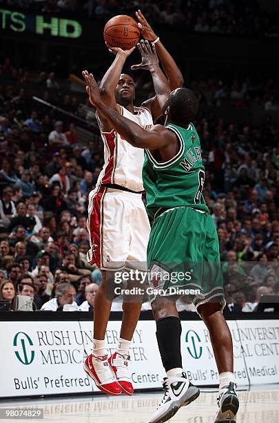 Jawad Williams of the Cleveland Cavaliers shoots against Ronald Murray of the Chicago Bulls during the game on March 19, 2010 at the United Center in...