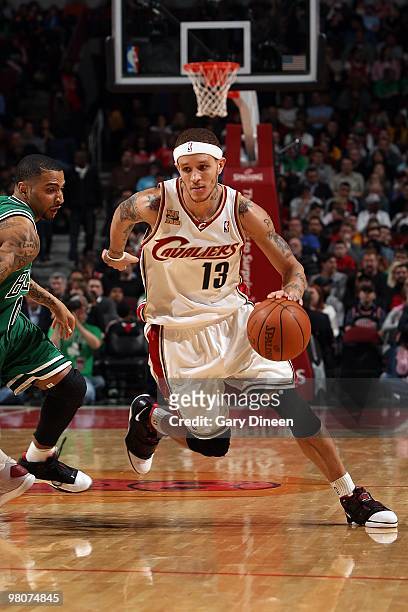 Delonte West of the Cleveland Cavaliers drives past Acie Law of the Chicago Bulls during the game on March 19, 2010 at the United Center in Chicago,...