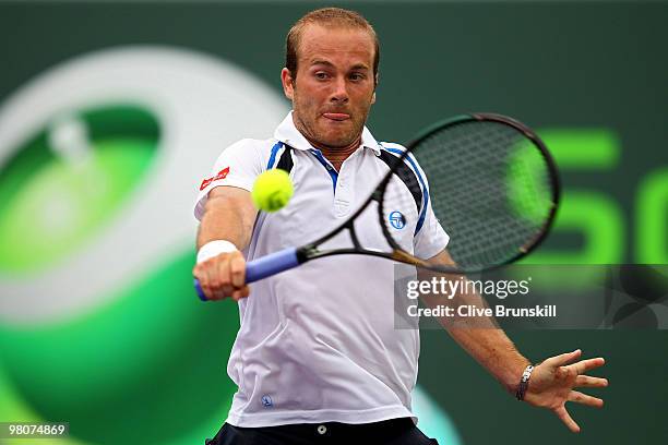 Olivier Rochus of Germany returns a shot against Novak Djokovic of Serbia during day four of the 2010 Sony Ericsson Open at Crandon Park Tennis...