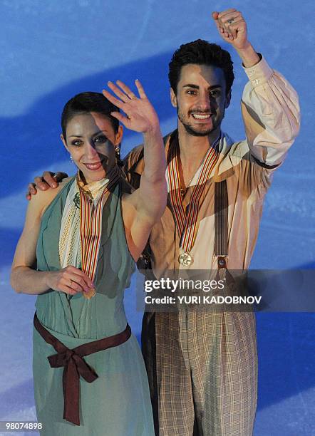 Bronze medalists Italy's Federica Faiella and Massimo Scali celebrate on the podium of the Ice Dance competition at the World Figure Skating...