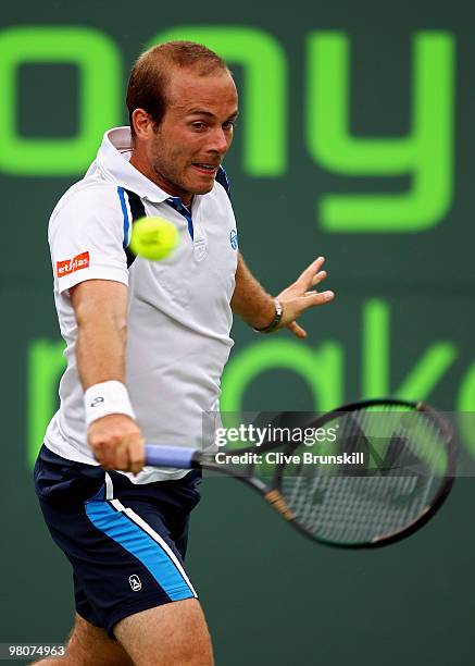 Olivier Rochus of Germany returns a shot against Novak Djokovic of Serbia during day four of the 2010 Sony Ericsson Open at Crandon Park Tennis...