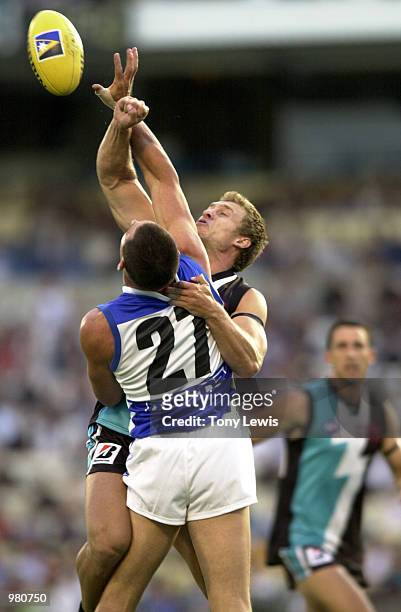 Michael Wilson for Port Adelaide spoils a mark for Adam Lange for the Kangaroos in the Ansett Cup semi-final match between Port Power and the North...