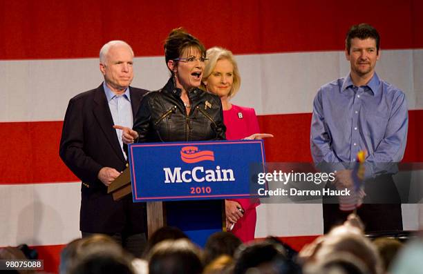 Former Alaska Gov. Sarah Palin speaks as U.S. Sen. John McCain his wife Cindy McCain and Palin's husband Todd Palin look on during a campaign rally...