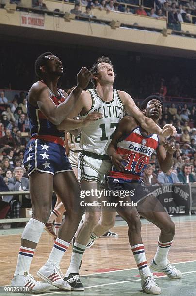 Boston Celtics John Havlicek in action vs Washington Bullets Elvin Hayes and Kevin Porter . Boston, MA 2/3/1974 CREDIT: Tony Triolo