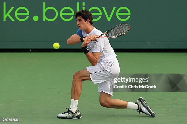 Thomaz Bellucci of Brazil returns a shot against James Blake of the United States during day four of the 2010 Sony Ericsson Open at Crandon Park...