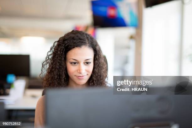 confident businesswoman using computer in office - computer front view stock pictures, royalty-free photos & images