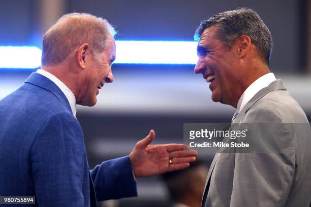 Head coach John Beilein of the Michigan Wolverines speaks to head coach of Jay Wright of the Villanova Wildcats during the 2018 NBA Draft at the...