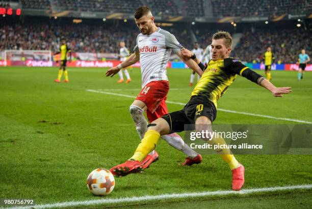 Dortmund's Maximilian Philipp and Salzburg's Valon Berisha battle for the ball during the UEFA Europa League round of 16 second leg soccer match...