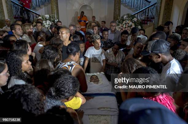 Relatives and friends attend the wake of Marcos Vinicius da Silva shot dead during a police operation at Mare favela, at the City Hall palace in Rio...