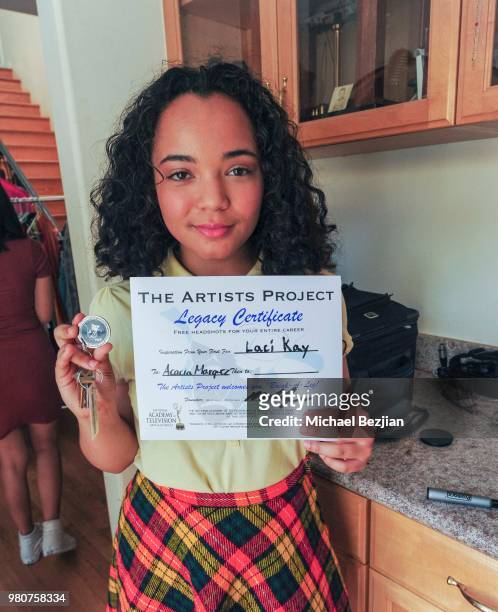 Acacia Marquez receives TAP Medallion and Certificate from Laci Kay at Artists helping Artists at TAP on June 20, 2018 in Los Angeles, California.