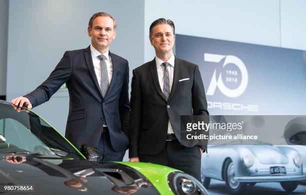 Dpatop - 16 March 2018, Germany, Stuttgart: Oliver Blume , CEO of Porsche AG, and Lutz Meschke, deputy chairman, appear at an annual press conference...