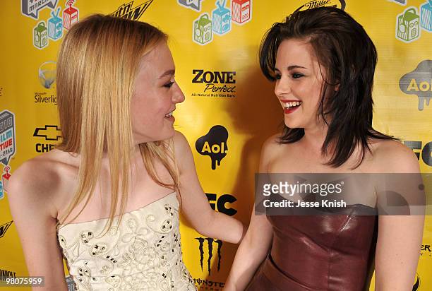 Dakota Fanning and Kristen Stewart attend the movie premiere of "The Runaways" during the 2010 SXSW Festival on March 18, 2010 in Austin, Texas.