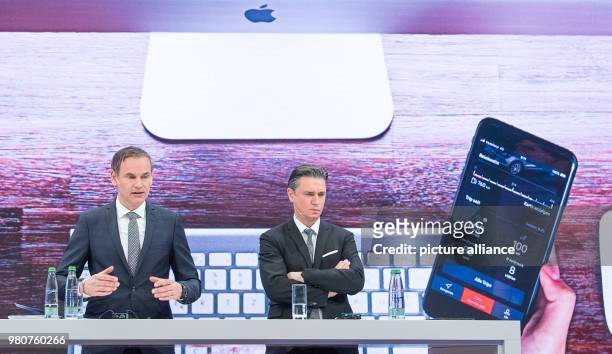 March 2018, Germany, Stuttgart: Oliver Blume , CEO of Porsche AG, and Lutz Meschke, deputy chairman, appear at an annual press conference to present...