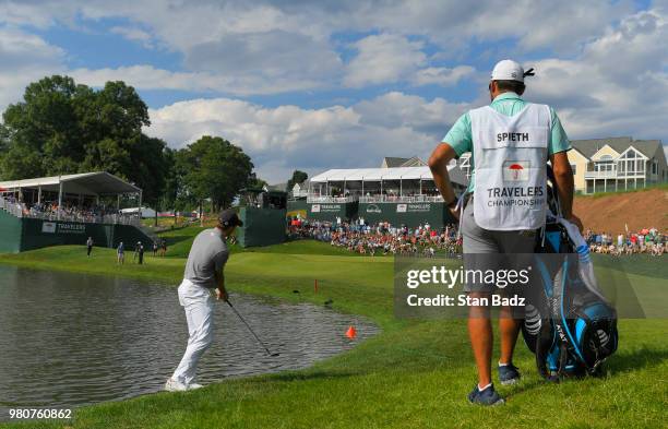 Jordan Spieth plays a chip shot on the 15th hole during the first round of the Travelers Championship at TPC River Highlands on June 21, 2018 in...