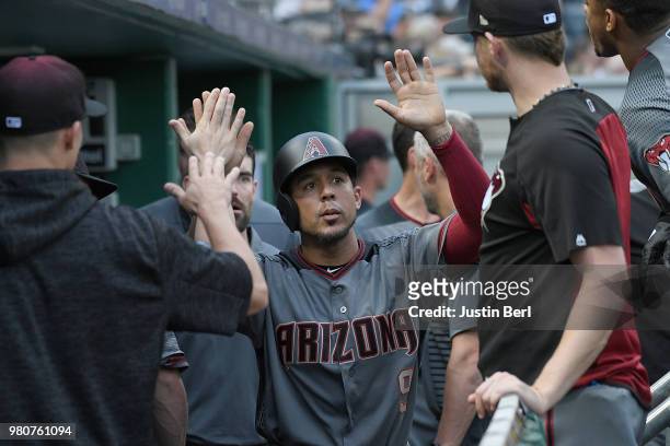 Jon Jay of the Arizona Diamondbacks is greeted by teammates in the dugout after coming around to score on an RBI single by Paul Goldschmidt in the...
