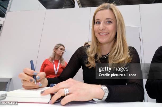 March 2018, Germany, Leipzig: Folk singer Stefanie Hertel presents her book 'Über jeden Bach führt eine Brücke' published by Randomhouse at the...