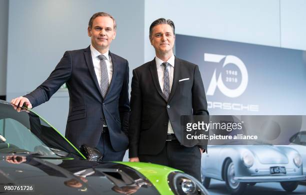 Dpatop - CEO of Porsche AG Oliver Blume and deputy chairman Lutz Meschke attend an annual press conference to present their company's figures from...