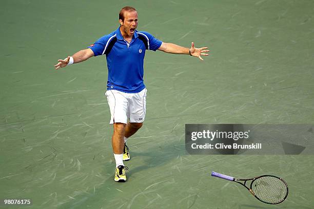 Olivier Rochus of Germany celebrates match point against Novak Djokovic of Serbia during day four of the 2010 Sony Ericsson Open at Crandon Park...