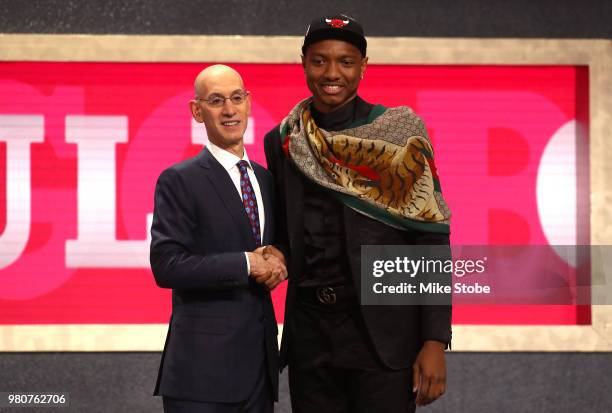 Wendell Carter Jr. Poses with NBA Commissioner Adam Silver after being drafted seventh overall by the Chicago Bulls during the 2018 NBA Draft at the...