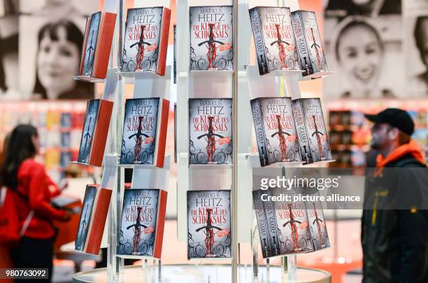 March 2018, Germany, Leipzig: A shelf with books is displayed at the stand of Droemer Knaur in the halls of the Leipzig book fair. This year's book...