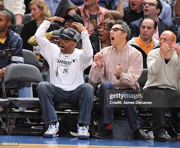 Spike Lee and John Turturro attend a game between the Philadelphia 76ers and the New York Knicks at Madison Square Garden on March 19, 2010 in New...