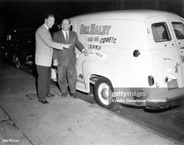 Bill Haley and Decca Records executive Milt Gabler pose for a portrait with a tour van that reads Bill Haley and the Comets in 1955 in New York, New...