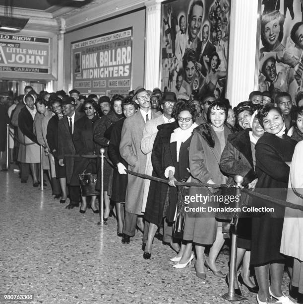 Crowd waits in line outside the Apollo Theater in circa 1959 in New York. The marquee reads Hank Ballard and the Midnighters, Little Willie John.