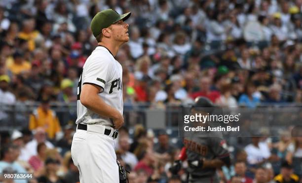 Chad Kuhl of the Pittsburgh Pirates reacts after giving up a two run home run to Alex Avila of the Arizona Diamondbacks in the third inning during...