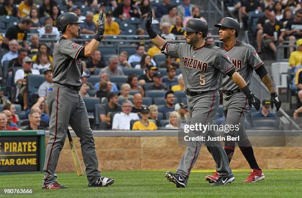 Alex Avila of the Arizona Diamondbacks high fives with Nick Ahmed after hitting a two run home run in the third inning during the game against the...