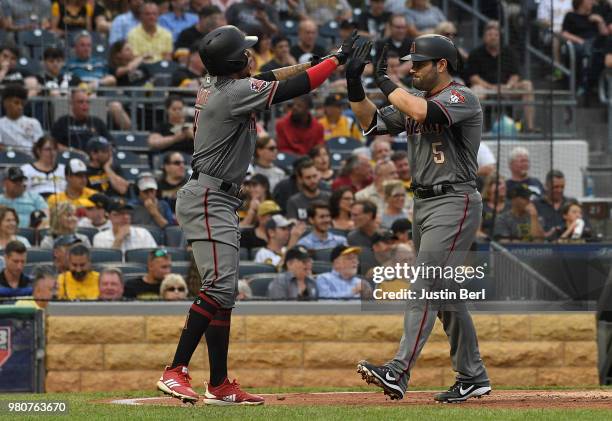 Alex Avila of the Arizona Diamondbacks high fives with Ketel Marte after hitting a two run home run in the third inning during the game against the...