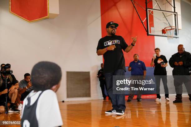 Rap Artist Ice Cube talks with participants during the Young3 Basketball Clinic and Tournament on June 21, 2018 in Houston, Texas.