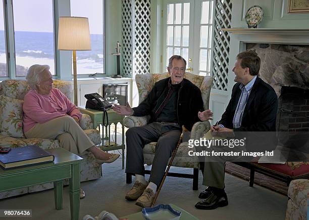 Former President George H.W. Bush with former First Lady Barbara Bush during an interview with author David Baldacci for Parade Magazine at their...
